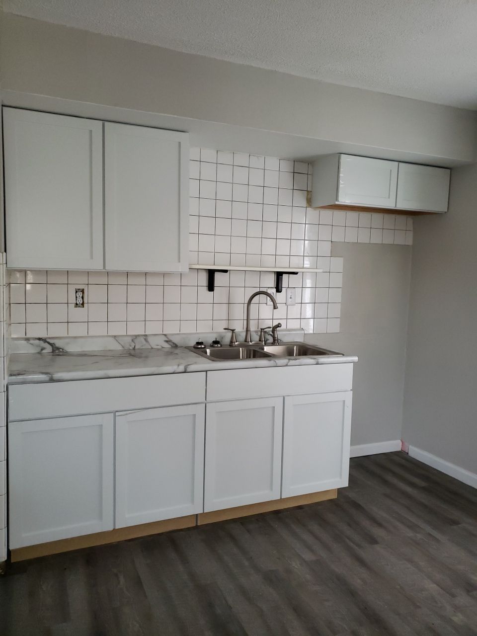 Brand new cabinets, countertops and sink. Cleaned up the tile as well